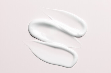A sample of a white moisturizing cosmetic cream for the body or face
