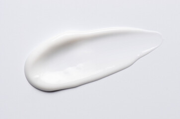 A sample of a white moisturizing cosmetic cream for the body or face