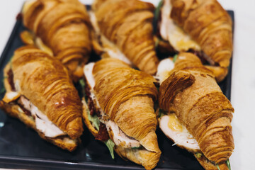 Catering table, beautifully decorated banquet with variety different food snacks appetizers on christmas corporate birthday party event or wedding celebration, canape, salad, delicatessen setting