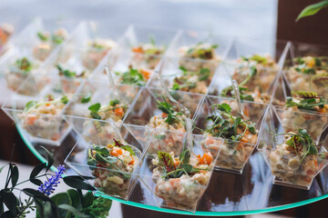 Catering table, beautifully decorated banquet with variety different food snacks appetizers on...