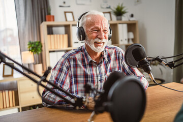 senior man host interviewer woman guest questions while record podcast