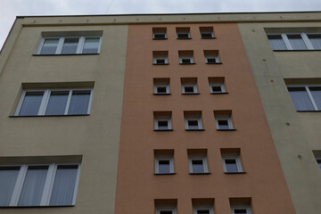 A structure featuring an abundance of windows that adorn its exterior, providing natural light and ventilation throughout the space