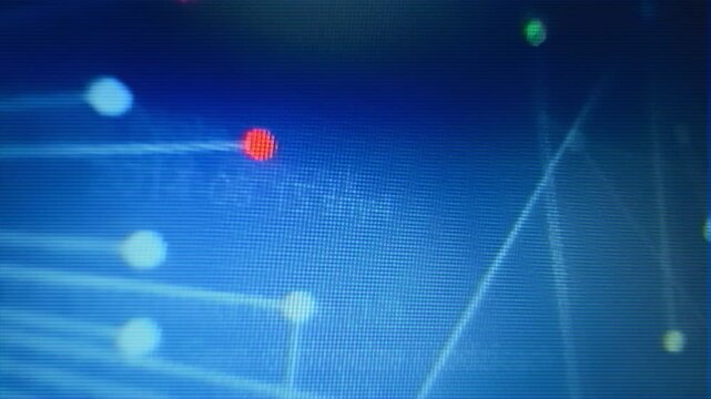 Closeup of computer monitor with blue animated scientific diagrams showing connected dots. Visible interlace lines. Flickering vintage 80s 90s vhs style video. Sci-fi computer background.