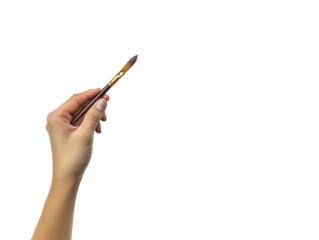 Creative individual holds a paintbrush poised for artistic expression and inspiration in a bright, minimalistic setting