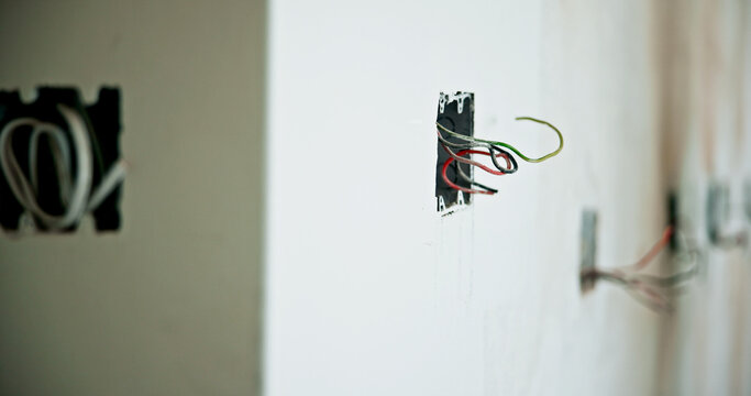 House, wall and electric wires for construction, remodeling project or renovation for home improvement. Cable, repair and power outlet for building, interior or energy system installation for upgrade