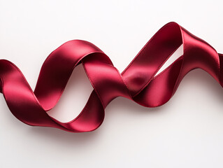  a large, red satin Christmas ribbon tied in a bow on a white background.