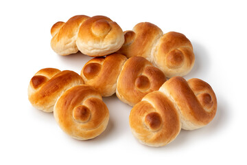 Fresh homemade white buns of bread in a special shape isolated on white background close up