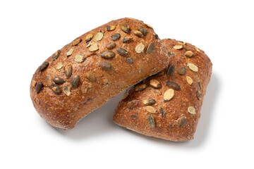 Pair of fresh homemade baked pumpkin seed buns isolated on a white background close up