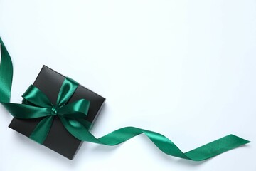 Beautiful gift box tied with bow on white background 