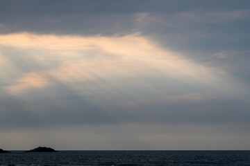 sunshine coming down from the sky to the sea