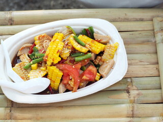  Som tum corn salad with sausage vietnamese style. Spicy Corn Salad. Corn salad is a popular dish seasoned with lime, fish sauce, sugar , fermented fish, Tomatoes, and  fresh vegetables herbs  
