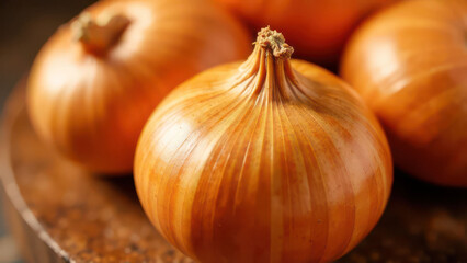 Fresh golden onions on rustic wooden table close-up