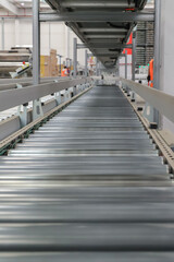 packing line in a logistics warehouse. conveyor belt in a modern production line