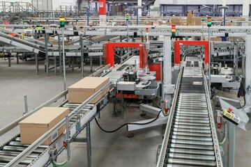 packing line in a logistics warehouse. conveyor belt in a modern production line