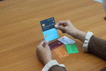 Woman Comparing Credit Cards: Choosing the Best Financial Option for Smart Spending
