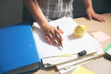 female hands with a notebook, writing notes