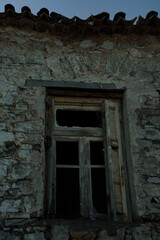 Old abandoned stone house in the forest