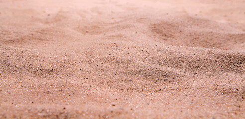 Sand beach texture summer background. Mockup and copy space. Top and front view. Selective focus full frame shot.