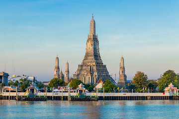 Beautiful of Buddhist temple or Wat Arun Ratchawararam Ratchawaramahawihan with famous tourist landmark sunlight in the morning, Bangkok, Thailand.