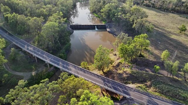 4K video, Dawson river weir, Theodore, central Queensland outback Australia, running water floodgate overflow