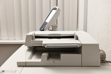 One modern printer in room, closeup view