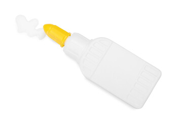 Bottle and stain of glue isolated on white, top view
