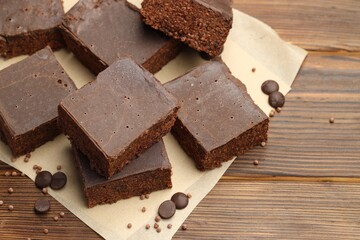 Delicious chocolate puffed rice bars on wooden table, closeup