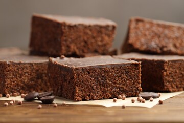 Delicious chocolate puffed rice bars on wooden table, closeup