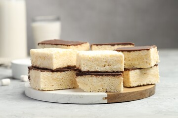 Delicious puffed rice bars on gray textured table, closeup