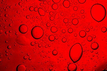 Red macro drink texture,Red close-up macro drink water drop surface,Water droplets on a glass of...
