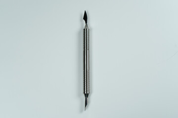 A pusher for manicures on a white background.