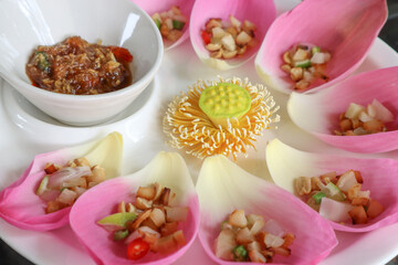 Savoury Sacred Lotus petals Wraps in thai called Miang Kham.Miang Kham sometimes uses the leaves of other types of vegetables as ingredients.