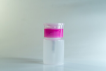 Pastel nail polish collection spilled on white background