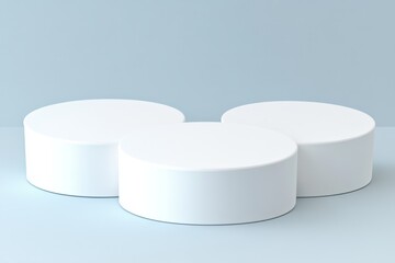 Three white cylindrical podiums on a light blue background.