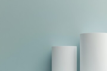 Two white cylinders against a light blue background.