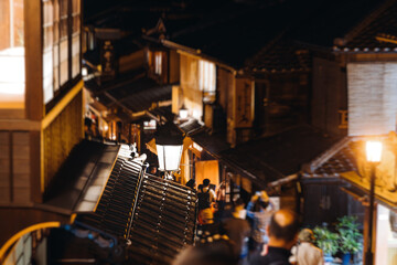 View of Gion district street, Kyoto, Higashiyama-ku, Japan, night illumination of Ninnenzaka and Sannenzaka streets, with old wooden tea houses Hokanji temple and Yasaka Pagoda, Gion geisha quarter