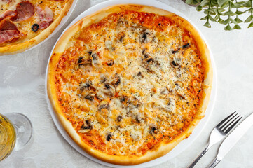 traditional Italian pizza on a white plate