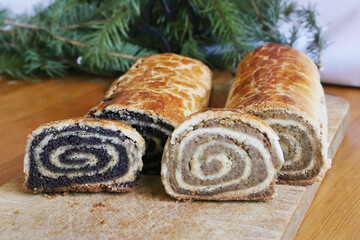Homemade walnut and poppy seed rolls aka beigli in Hungary. Traditional hungarian christmas or easter cake bejgli at christmastime