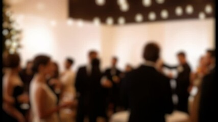 blurred scene of a Cocktail party atmosphere with guests socializing and enjoying drinks
