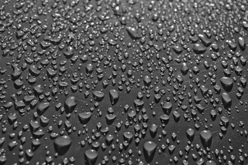 water drops on grey glass close up