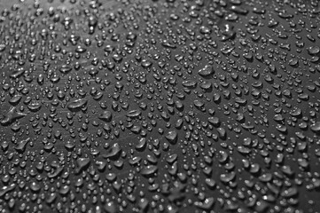 water drops on grey glass close up