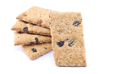 Rustic cereal cookies with dried fruits. White background.