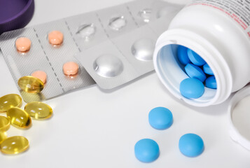 Top view of packs of pills, capsules and container