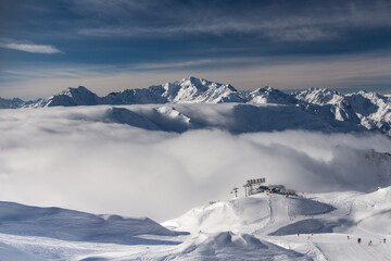 Ski lift in St. Anton am Arlberg,Beautiful winter landscape in the Alps, near St. Anton am Arlberg, above the clouds with sunshine