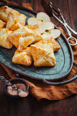Homemade flaky pastry filled with apple mousse and cinnamon