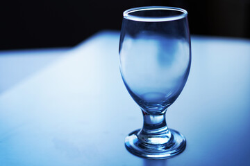 glass of wine cup on blue background