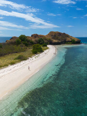Breathtaking secluded beach with clear turquoise waters and lush greenery.