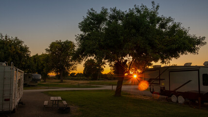 Sunset with sunburst camping in Rv trailer