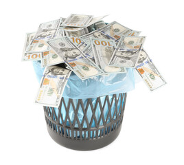 Many dollar banknotes in trash bin isolated on white