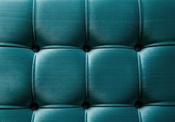 Teal upholstery forms a luxurious and elegant pattern, ideal for furniture design